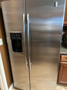 Stainless steel refrigerator repair service in modern kitchen Round Rock TX