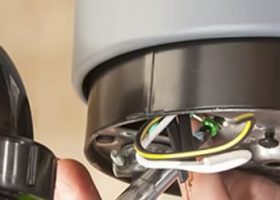 Garbage disposal electrical repair under kitchen sink in Austin TX